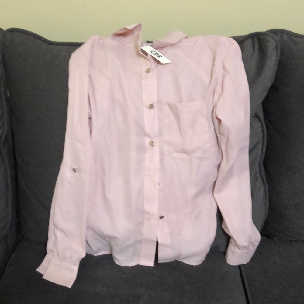 Dress up or dress casual with this light pink top